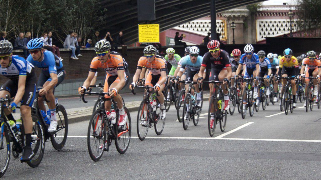 Tour riders stream along the Embankment on the last day of the Tour of Britain